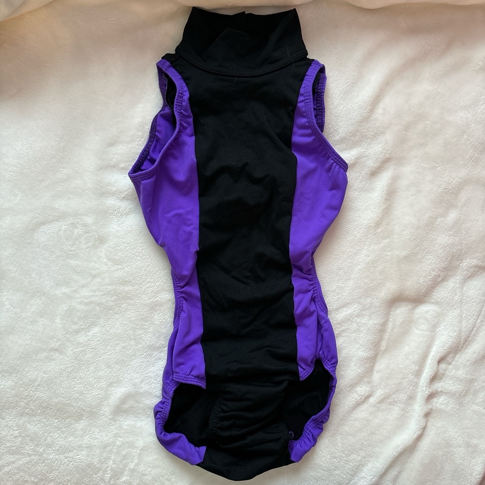 barely worn t-wear bright purple and black leotard with a high neck